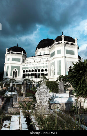 Grand Mosque of Medan with gravestones in Medan, Sumatra, Indonesia Stock Photo