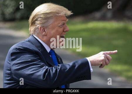 Washington, District of Columbia, USA. 2nd Oct, 2018. United States President Donald J. Trump speaks with members of the media prior to boarding Marine One for his departure from the White House. Credit: Alex Edelman/CNP/ZUMA Wire/Alamy Live News Stock Photo