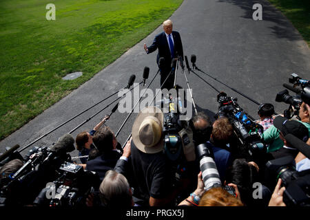 Washington, DC, USA. 2nd Oct, 2018. U.S. President Donald Trump speaks to reporters before leaving the White House in Washington, DC, the United States, on Oct. 2, 2018. Credit: Ting Shen/Xinhua/Alamy Live News Stock Photo