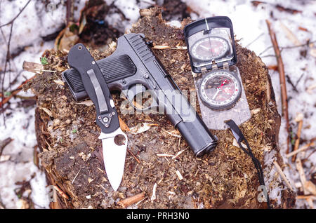 Pistol, knife and compass. Military set. The weapon. Top. Stock Photo