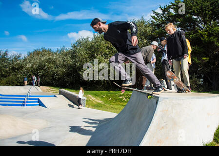 A skateboarder pushing off from a deck at Concrete Waves in Newquay in Cornwall. Stock Photo