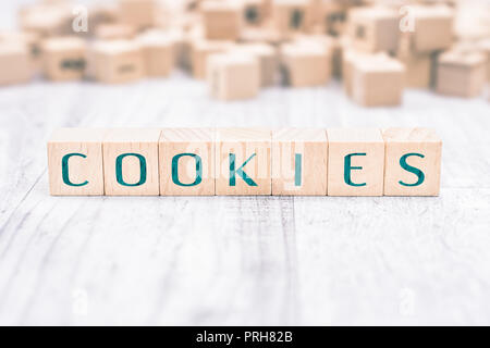 The Word Cookies Formed By Wooden Blocks On A White Table Stock Photo