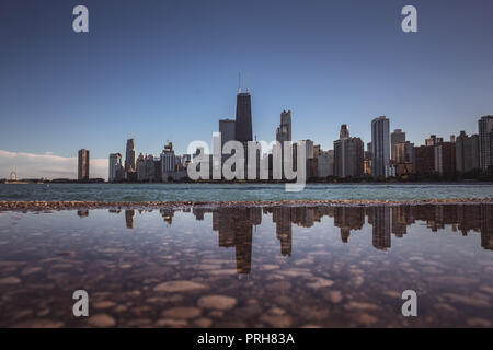 Chicago skyline reflected in a puddle Stock Photo