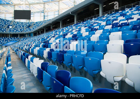 Sport stadium Plastic chairs in a row. Stock Photo