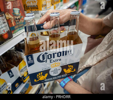 A shopper chooses a six-pack of Constellation Brands' Corona Extra beer in a supermarket in New York on Tuesday, October 2, 2018.  (Â© Richard B. Levine) Stock Photo