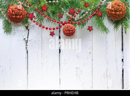 Christmas fir tree with decoration on a wooden board. Stock Photo