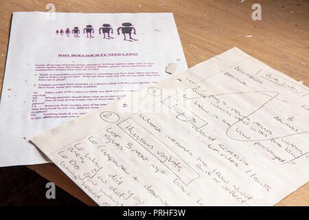 Teaching notes for a lesson on law and order, human rights and morality inside the classroom of a juvenile detention centre. Stock Photo