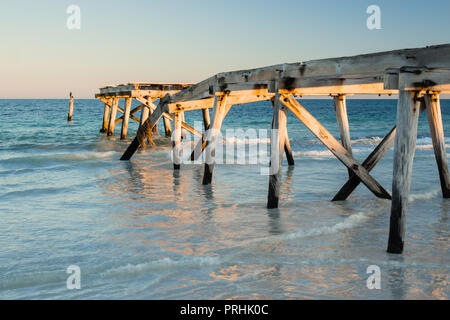 The ruins of the old historic wooden jetty on the coastline at Eucla Western Australia Stock Photo