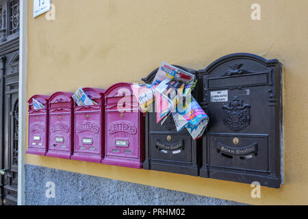 RIVA DEL GARDA, ITALY - JULY 10, 2015: Mailboxes on the wall of a house in the town of Riva Del Garda Stock Photo
