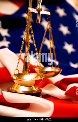scales and USA flag concept for justice in United States of America Stock Photo