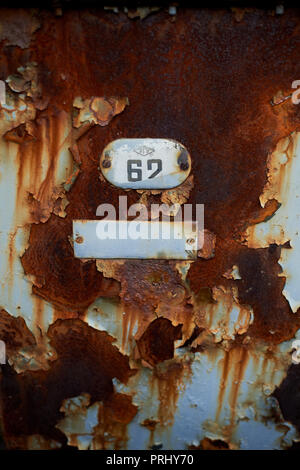 Texture, rusty iron sheet and normer 62 on it. Retro.Abandoned buildings Stock Photo