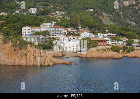 Rocky coast with the seaside village Fornells de Mar in the Aiguablava bay, Spain, Costa Brava, Mediterranean sea, Catalonia, Girona, Baix Emporda Stock Photo