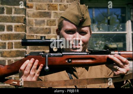 WW2 Reenactor Soviet Sniper holds a Moisin Nagent Rifle Stock Photo