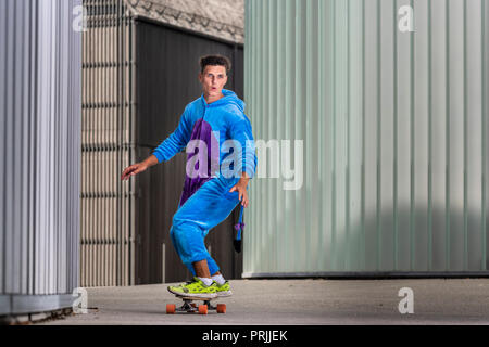 Teenager, 17 years, rides Longboard wearing a onepiece, Germany Stock Photo