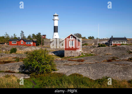 Red wooden houses with lighthouse, Stockholm archipelago, Huvudskär archipelago island, Sweden Stock Photo