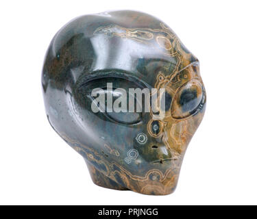 Ocean jasper from Madagascar carved alien crystal skull  isolated on white background Stock Photo