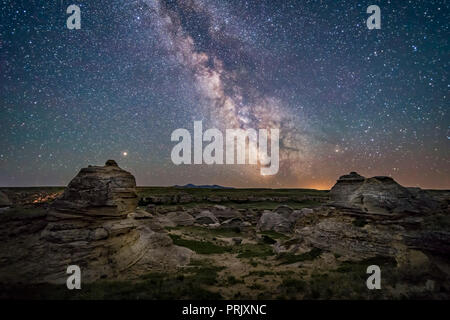 Mars (at left) and the galactic centre area of the summer Milky Way low over the southern horizon at Writing-on-Stone Provincial Park, Alberta, on Jun Stock Photo