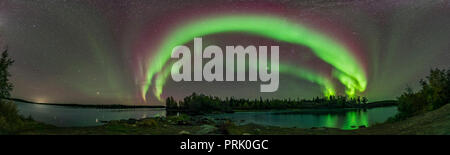 A 180° panorama of a developing aurora display near Yellowknife, NWT, at Tibbit Lake. This was September 8, 2018. The Kp Index was officially only 2!  Stock Photo