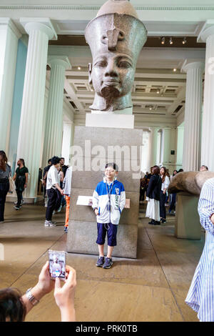 London England,UK,Bloomsbury,The British Museum,human culture history,interior inside,gallery,colossal statue,Amenhotep III,red granite,18th Dynasty A Stock Photo