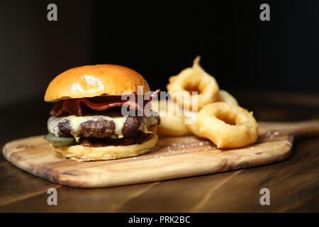 Pictured: Burger with bacon, cheddar & cherry tomato jam at Jack & Knife restaurant at 76 Stanley St, Darlinghurst, Sydney, Australia. Stock Photo