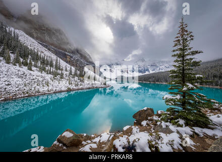 Moraine Lake is a glacially fed lake in Banff National Park, 14 kilometres (8.7 mi) outside the Village of Lake Louise, Alberta, Canada. Stock Photo