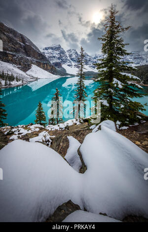 Moraine Lake is a glacially fed lake in Banff National Park, 14 kilometres (8.7 mi) outside the Village of Lake Louise, Alberta, Canada. Stock Photo