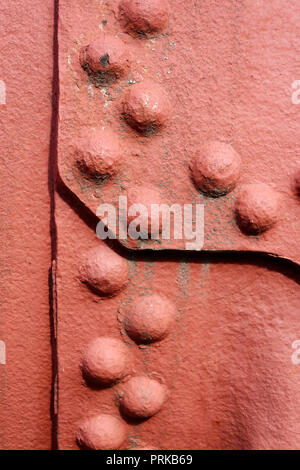 Backgrounds and textures: old painted metal wall surface with riveted joints, industrial abstract Stock Photo