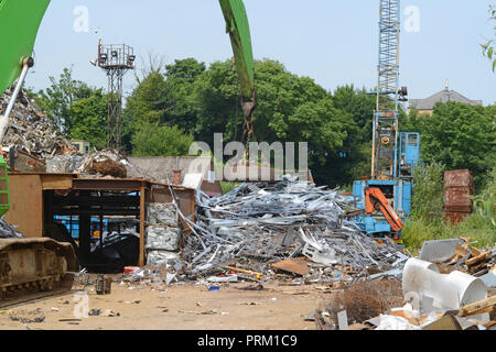 electomagnetic on crane sorting through scrap metal at scrapyard leeds yorkshire united kingdom Stock Photo
