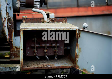 Old rusty electric shield in an abandoned building.Retro Stock Photo