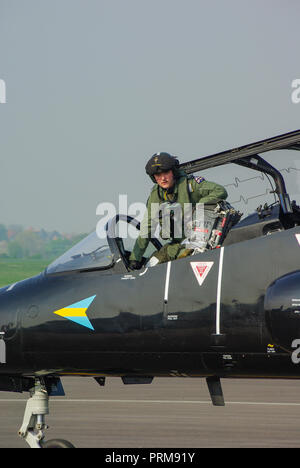 RAF, Royal Air Force solo Hawk display pilot Matt Barker climbing out of BAe Hawk T1 jet plane cockpit. Flight suit. Flying suit Stock Photo