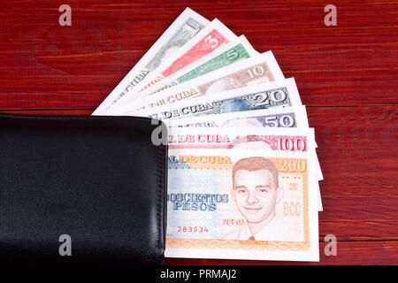 Cuban money in the black wallet Stock Photo