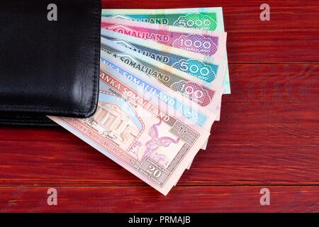 Money from Somaliland in the black wallet Stock Photo