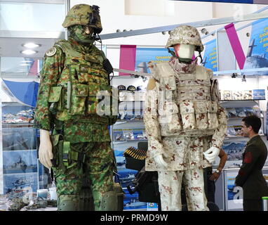 KAOHSIUNG, TAIWAN -- SEPTEMBER 29, 2018: A trader sells military fatigues at Kaohsiung International Maritime & Defence Expo Stock Photo