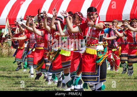 KAOHSIUNG, TAIWAN -- SEPTEMBER 29, 2018: Members of the indigenous Amis tribe in traditional costumes participate in the yearly harvest festival. Stock Photo