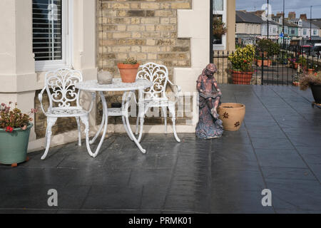 Table and chairs on patio Stock Photo