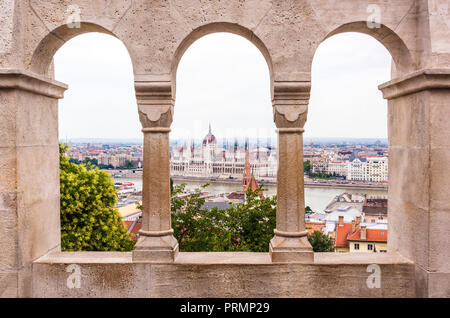 Views towards Danube and Hungarian Parliament from the arches of Fisherman’s Bastion, Budapest, Hungary Stock Photo