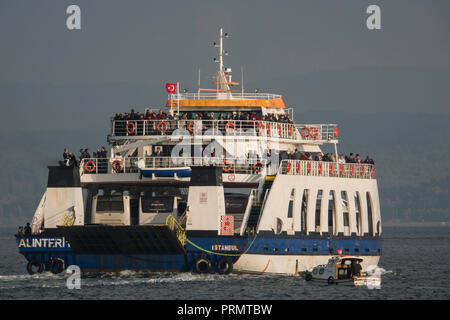 Passenger and vehicle ferry crosses the Dardanelles Strait from Canakkale to Eceabat, in Canakkale, Turkey Stock Photo
