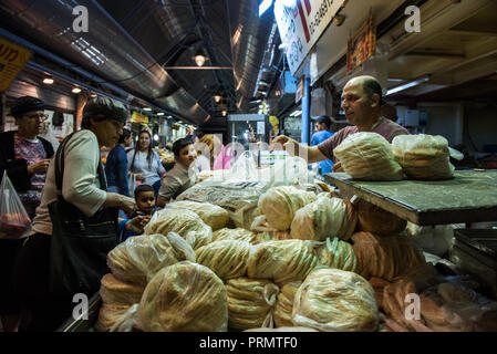 JERUSALEM, ISRAEL - MAY 15, 2016: Tourists and local Jewish people visiting the local market of the Holy city, the Machane Yehuda Stock Photo