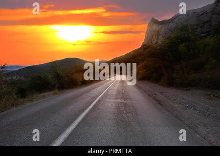 beautiful sunset over the country mountain highway