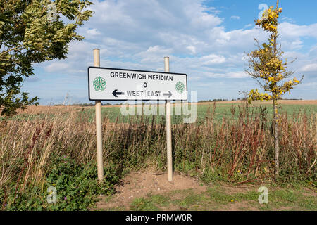 Shown is in East Riding of Yorkshire in the village of Patrington is the marker signpost for the Greenwich Meridian line of zero degrees set against a