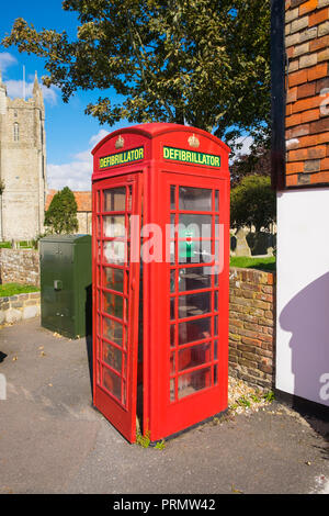 Defibrillator in a red telephone box, lydd, kent, uk Stock Photo