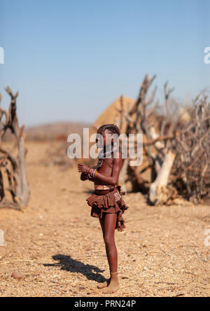 Himba tribe girl in her village, Cunene Province, Oncocua, Angola Stock Photo