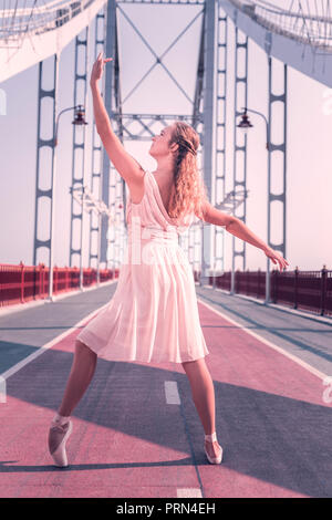 Nice beautiful young woman holding her hand up Stock Photo
