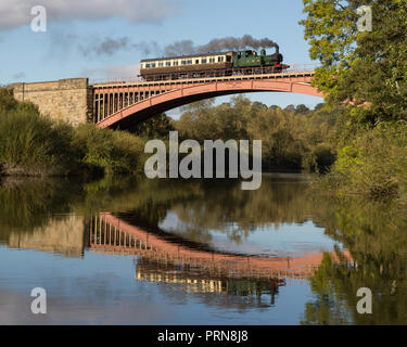 Worcestershire, United Kingdom. 3rd October 2018. In a scene reminiscent of the early 20th century branch line, Great Western Railway tank engine 1450 and an autocoach are seen at various locations on the popular preserved line. Here the train is seen crossing the River Severn on the 200 foot single span Victoria Bridge. Credit: Andrew Plummer/Alamy Live News Stock Photo