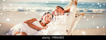 Composite image of calm couple napping in a hammock Stock Photo