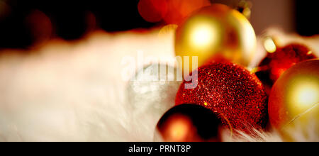 Colored Christmas ornaments on a carpet Stock Photo