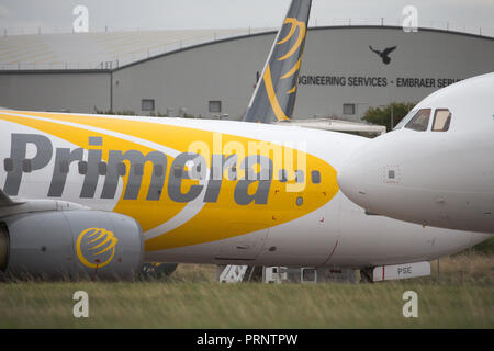 Picture dated October 3rd shows the planes of Primera Air being stored in a corner of Stansted Airport,Essex,after the company collapsed yesterday.    Primera Air ceased all operations at midnight on Monday, after 14 years in business.  The airline, which had 15 planes, began offering long-haul flights from UK airports, including Stansted and Birmingham, earlier this year.  The UK's Civil Aviation Authority has told passengers who have travelled abroad on a Primera flight that they must now make their own arrangements to return to the U Stock Photo