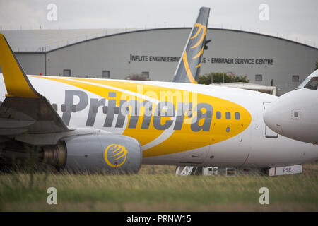 Picture dated October 3rd shows the planes of Primera Air being stored in a corner of Stansted Airport,Essex,after the company collapsed yesterday.    Primera Air ceased all operations at midnight on Monday, after 14 years in business.  The airline, which had 15 planes, began offering long-haul flights from UK airports, including Stansted and Birmingham, earlier this year.  The UK's Civil Aviation Authority has told passengers who have travelled abroad on a Primera flight that they must now make their own arrangements to return to the U Stock Photo