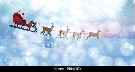 Composite image of side view of santa claus riding on sleigh during christmas Stock Photo