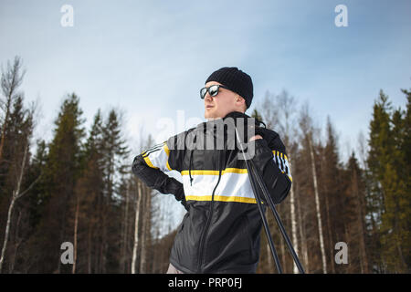 Middle Aged Man On Ski Holiday In The Forest. Stock Photo